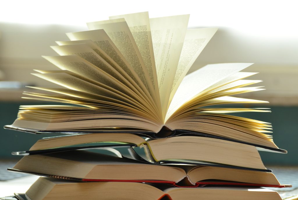 books book pages read literature 159866 159866 A close-up of a stack of open books with pages fanned out, capturing a study atmosphere.